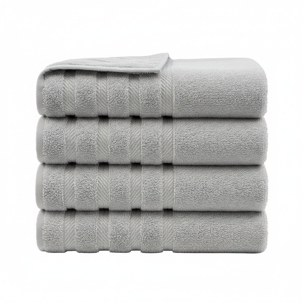 Stack of light gray towels on a white background